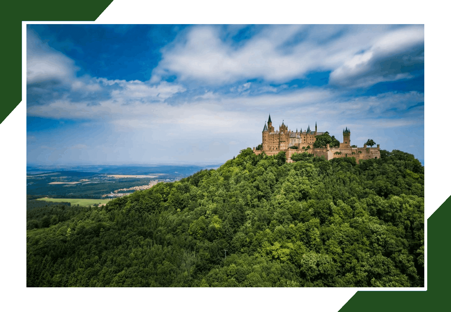 A castle on top of a hill with trees around it.